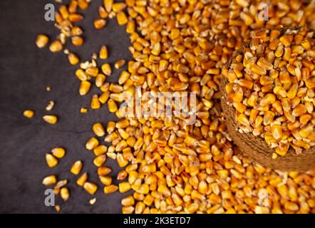 Top layer a corn grains in an jute sack on a dark background Stock Photo