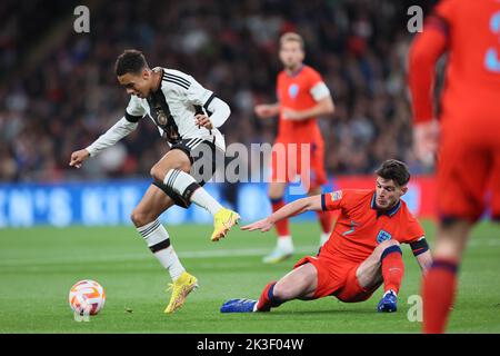 Declan Rice of England tussles with Jamal Musiala of Germany during the UEFA Nations League match between England and Germany at Wembley Stadium, London on Monday 26th September 2022. (Credit: Pat Scaasi | MI News) Credit: MI News & Sport /Alamy Live News Stock Photo