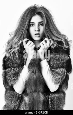 Female brown fur coat. Fur store model enjoy warm in soft fluffy coat with collar. Fur fashion concept. Woman makeup and hairstyle posing mink or Stock Photo