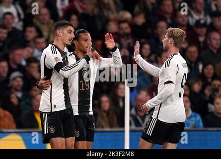 Germany's Kai Havertz celebrates scoring their side's second goal of the game with team-mates Leroy Sane and Timo Werner (right) during the UEFA Nations League match at Wembley Stadium, London. Picture date: Monday September 26, 2022. Stock Photo