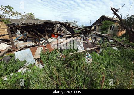 KHARKIV REGION, UKRAINE - SEPTEMBER 26, 2022 - Aftermath of hostilities in the village of Dementiyivka recently liberated from russian invaders, fragments of a destroyed building, Karkiv Region, north-eastern Ukraine. Stock Photo