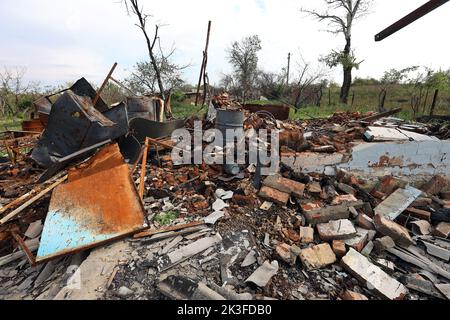KHARKIV REGION, UKRAINE - SEPTEMBER 26, 2022 - Aftermath of hostilities in the village of Dementiyivka recently liberated from russian invaders, the ruins of a destroyed building, Kharkiv Region, north-eastern Ukraine. Stock Photo
