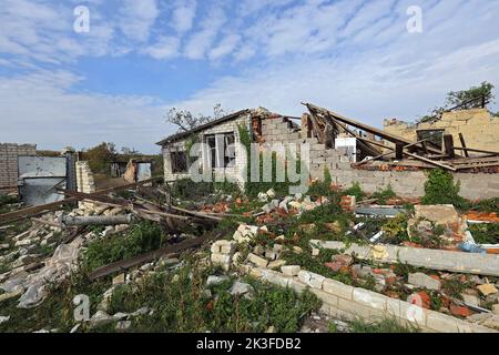 KHARKIV REGION, UKRAINE - SEPTEMBER 26, 2022 - Aftermath of hostilities in the village of Dementiyivka recently liberated from russian invaders, the ruins of a destroyed building, Kharkiv Region, north-eastern Ukraine. Stock Photo