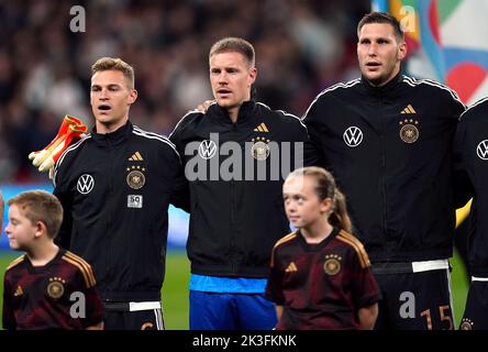 Germany's Joshua Kimmich, goalkeeper Marc-Andre ter Stegen and Niklas Sule (left-right) during the UEFA Nations League match at Wembley Stadium, London. Picture date: Monday September 26, 2022. Stock Photo