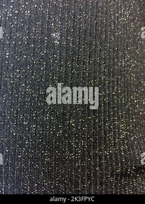 Black fabric texture with silver glitter sparkles close up Stock Photo