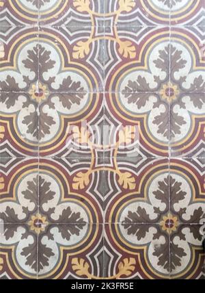 Antique colorful cement tile floor with intricate decorative ornament in old house interior Stock Photo