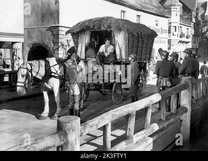 Ray Milland (seated, wagon) on-set of the Film, 'Golden Earrings', Paramount Pictures, 1947 Stock Photo