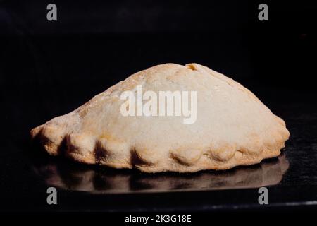 Baked homemade shortcrust pastry pie in electric oven - close up Stock Photo