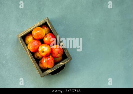 Ripe red apples in wooden box. Top view with space for your text Stock Photo