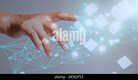 Abstract businessman fingers showing square box icon and virtual world data connection graph showing dynamic trends. Stock Photo
