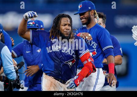 TORONTO, ON - SEPTEMBER 30: Toronto Blue Jays Right Field Teoscar Hernandez  (37) celebrates making the playoffs in the club house after the regular  season MLB game between the Boston Red Sox