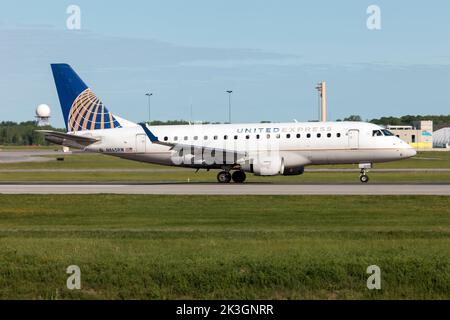 A United Express (Republic Airways) Embraer 170-100SE at Montreal Pierre Elliott Trudeau International Airport. Republic Airways operates service as American Eagle, Delta Connection, and United Express using a fleet of Embraer 170 and Embraer 175 regional jets. It is headquartered in Indianapolis, Indiana Stock Photo