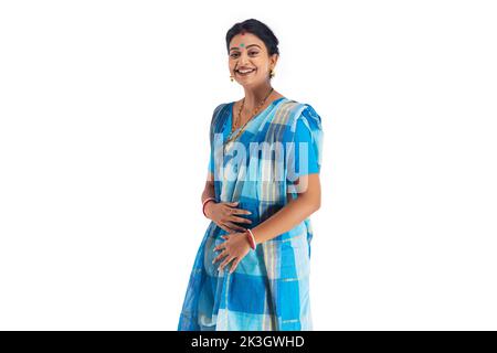 Portrait of Bengali housewife gesturing against white background Stock Photo
