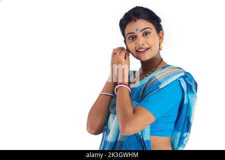 Bengali housewife wearing earring against white background Stock Photo
