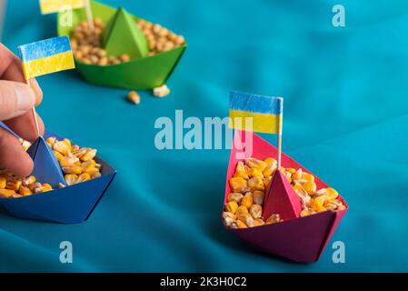 Ships with Ukrainian maize grain made of paper concept Stock Photo