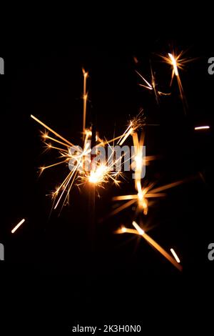 Real sparkler with sparks on black background for overlay blending mode Stock Photo