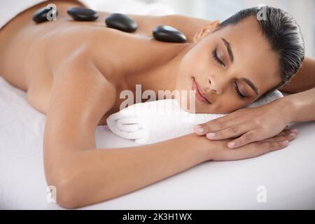 Keep calm and spa on. a beautiful young woman relaxing during spa treatment. Stock Photo