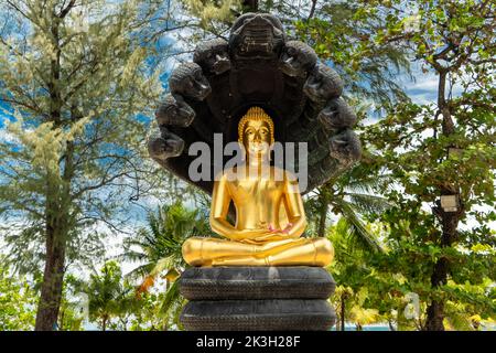 Golden Buddha statue on Patong Beach, Phuket, Thailand Stock Photo