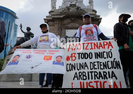 Mexico, Mexico. 26th Sep, 2022. Protesters hold banners during a demonstration to commemorate the 8th anniversary of the disappearance of the 43 Ayotzinapa students. On the night of September 26, 2014, 43 students from the Raœl Isidro Burgos Rural Normal School located in Iguala, Guerrero, were victims of forced disappearance by members of public security from the state of Guerrero and federal military security.The students had allegedly tried to hijack trucks to use for their protests. (Photo by Guillermo Diaz/SOPA Images/Sipa USA) Credit: Sipa USA/Alamy Live News Stock Photo