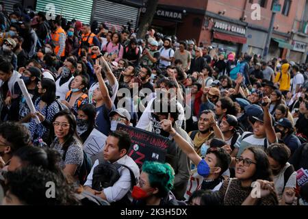 Mexico, Mexico. 26th Sep, 2022. Protesters raise their fists during a demonstration to commemorate the 8th anniversary of the disappearance of the 43 Ayotzinapa students. On the night of September 26, 2014, 43 students from the Raœl Isidro Burgos Rural Normal School located in Iguala, Guerrero, were victims of forced disappearance by members of public security from the state of Guerrero and federal military security.The students had allegedly tried to hijack trucks to use for their protests. (Photo by Guillermo Diaz/SOPA Images/Sipa USA) Credit: Sipa USA/Alamy Live News Stock Photo