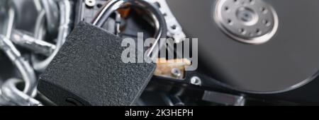 Data on cd rom secured with chain and padlock equipment, key hole Stock Photo