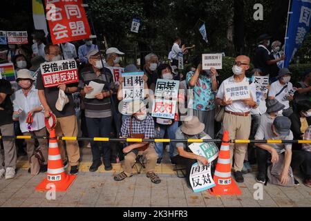 Tokyo, Japan. 27th Sep, 2022. Protesters hold placards expressing their opinions during the demonstration. Demonstrators gathered in front of the National Diet Building (Tokyo) to express their dissatisfaction with the government's decision to give former Japanese Prime Minister Shinzo Abe a state funeral. They criticize the high costs and the late timing of the funeral. (Photo by Stanislav Kogiku/SOPA Images/Sipa USA) Credit: Sipa USA/Alamy Live News Stock Photo