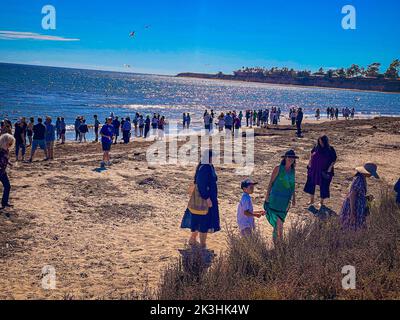 Goleta, CA, U.S.A. 26th Sep, 2022. Tashlich, which literally translates to 'casting off,'' is a ceremony performed on the afternoon of the first day of Rosh Hashanah. During this ceremony, Jews symbolically cast off the sins of the previous year by tossing pebbles or bread crumbs into flowing water. In Santa Barbara, September 26, 2022, hundreds of members representing every Jewish congregation in Santa Barbara (including seven rabbis) met at Goleta Beach, a long time tradition. to enact this ancient rite, eat honey-bread and apples, swim and schmooze with community members, many who h Stock Photo