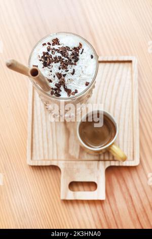 Iced coffee in jar, mug glass cup on the white table Stock Photo