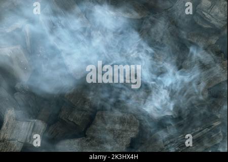 Smoking coals close up. Close up of burning coals Stock Photo