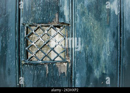 Emerald shabby door Cracked weathered wooden board texture Stock Photo