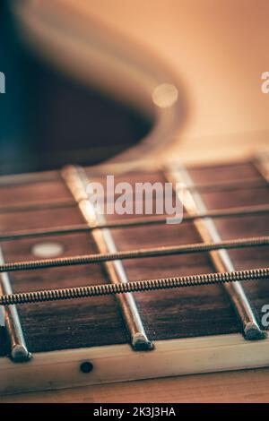 Strings on a classical acoustic guitar, macro shot. Stock Photo