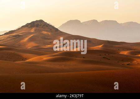 Maleha desert. Maleha is a big dunes in Sharjah, UAE. Fossil rock or pink rock is a hard rock structure right in between sand dunes, an natural wonder Stock Photo