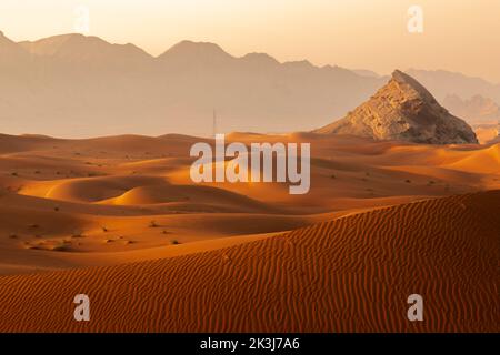 Maleha desert. Maleha is a big dunes in Sharjah, UAE. Fossil rock or pink rock is a hard rock structure right in between sand dunes, an natural wonder Stock Photo