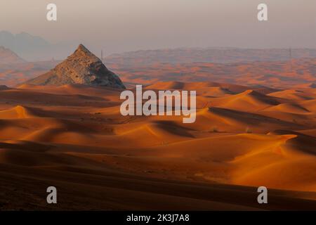 Maleha desert. Maleha is a big dunes in Sharjah, UAE. Fossil rock or pink rock is a hard rock structure right in between sand dunes, an natural wonder Stock Photo