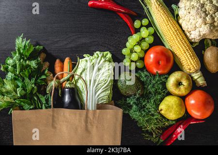 Flat lay, vegetables and fruits on a black background. Stock Photo