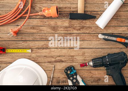 Flat lay composition with different construction tools on wooden background. Stock Photo