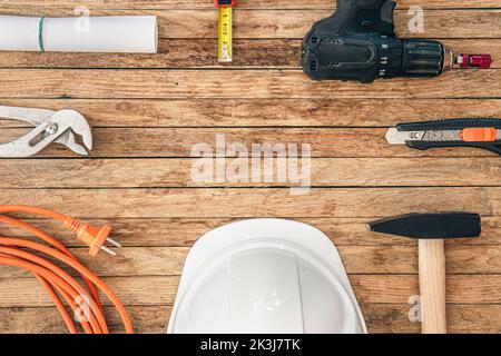 Flat lay composition with different construction tools on wooden background. Stock Photo