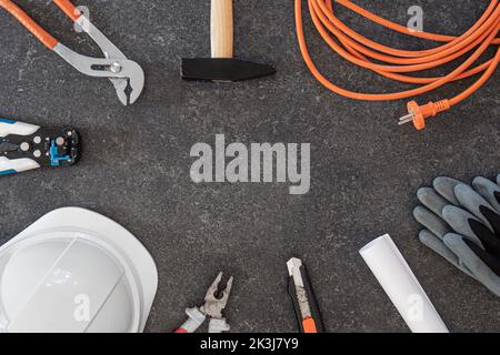 Set of repair tools on textured dark background, flat lay. Stock Photo