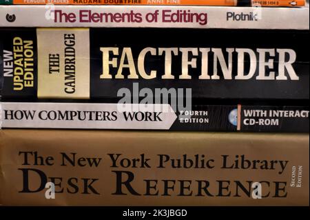 Side view of a pile of knowledgeable books Stock Photo