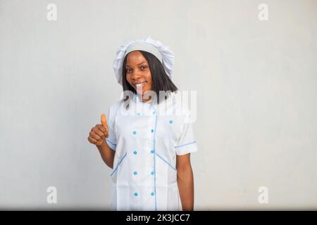 A portrait of a young black cook woman smiling Stock Photo