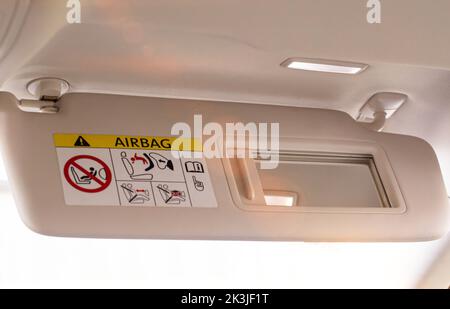 Modern car sun visor with mirror, close-up Stock Photo