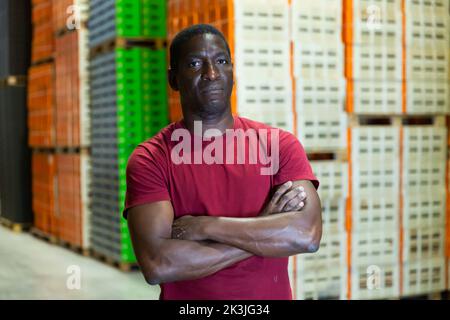 Portrait of afro man worker in warehouse Stock Photo