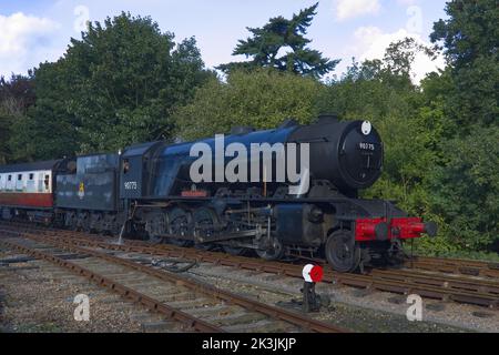 Steam locomotive WD 2-10-0 – 90775 ‘The Royal Norfolk Regiment’ pulling a train into Holt station, North Norfolk Railway Stock Photo