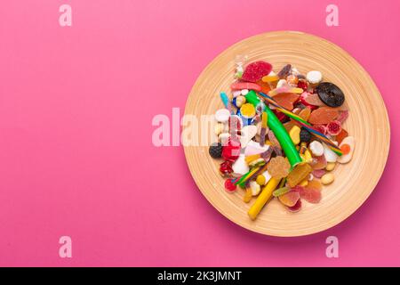 Colorful lollipops on a pink background Stock Photo