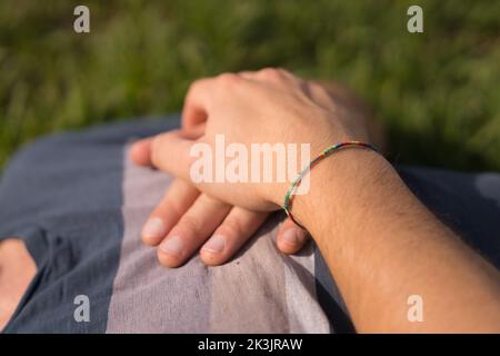 A Man's hands on his chest near to heart ,closeup shot Stock Photo