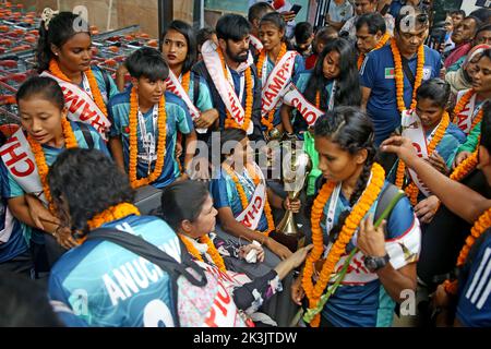 Bangladesh Women Football Team Captain Sabina Khatun (C) along Bangladesh Football Federation officials and teammates hold the trophy as they arrived Stock Photo