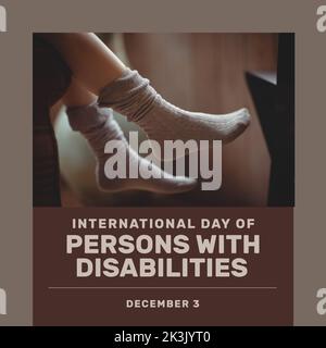 Composition of international day of persons with disabilities text over feet with socks Stock Photo