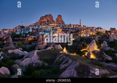 uchisar castle, Twilight photo of the perforated castle rock of Uçhisar, Goreme, Cappadocia, Anatolia, Turkey Stock Photo