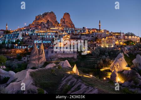 uchisar castle, Twilight photo of the perforated castle rock of Uçhisar, Goreme, Cappadocia, Anatolia, Turkey Stock Photo