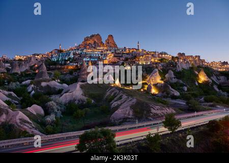 uchisar castle, Twilight photo of the perforated castle rock of Uçhisar, Goreme, Cappadocia, Anatolia, Turkey Stock Photo